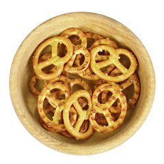 Pretzels in wooden bowl isolated on white background