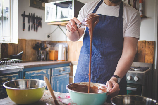 Close Up Image Of A Chef Stirring Cake Batter For Baking A Cake.