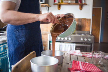 Close up image of a chef stirring cake batter for baking a cake.
