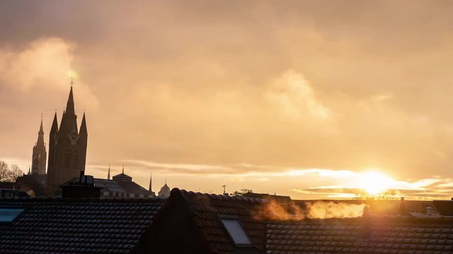 Colorful timelapse of sunrise over city of Delft in winter