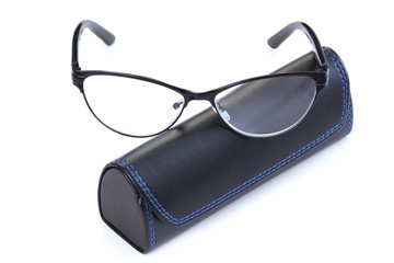 Optical glasses with leather case on white background
