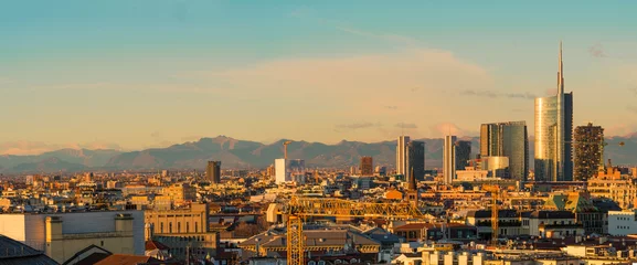 Foto auf Acrylglas Aerial view of Milan skyline at sunset with alps mountains in the background. © Arcansél