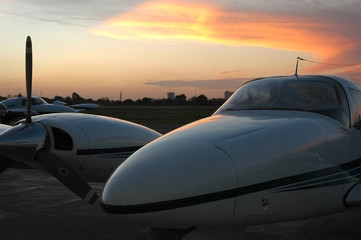 Fototapeta na wymiar airplane parked at sunset
