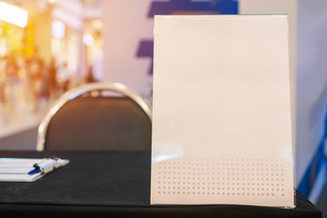 Stand White mockup acrylic frame tent card on counter reception in seminar check in for register,...