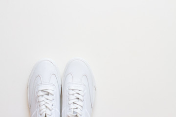 white pair leather sneakers and copyspace