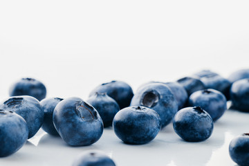 Fresh organic blueberries on a marble background, close up with copy space
