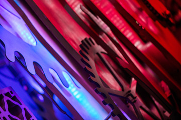 Abstract, colorful and blurry shot of steam punk gears and mechanisms. Rotating home decor and ornaments on wall