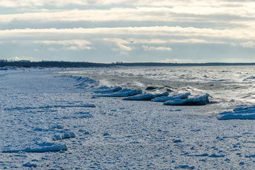 Icy Baltic sea coast in winter at Liepaja city, Latvia.