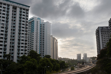 Fototapeta na wymiar Public housing HDB residentIal apartments with LRT track during sunset in Singapore