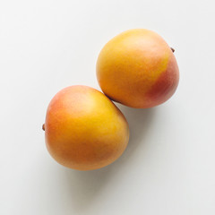 R2E2 mangos on a white background, top view