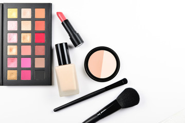 Professional makeup products with cosmetic beauty products, foundation, lipstick,  eye shadows, eye lashes, brushes and tools.