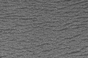 abstract rough gray surface background. Similar to asphalt, concrete, plastic. Gray matte texture of the cells.