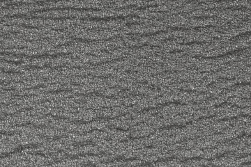 abstract rough gray surface background. Similar to asphalt, concrete, plastic. Gray matte texture of the cells.