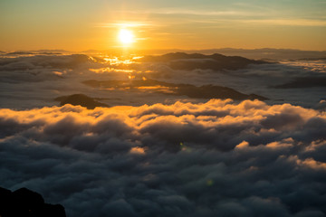 sunrise and sea of fog view on phu chi fa mountain area and national forest park in chiang rai,...