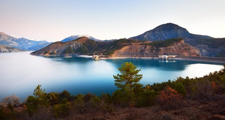 Panoramic view of lake Lac de serre-poncon in French Alps on a clear day