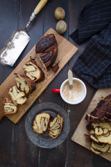 Babka jewish baked is ready to be eaten, over a wooden background, easter concept.