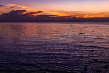 Obraz premium Beautiful amazing red velvet sunset sky at tropical island in Indian Ocean, Koh Phangan, popular tourist destination in Thailand.