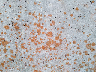 Concrete wall with splash of brown clay on it, liquid clay splash texture background