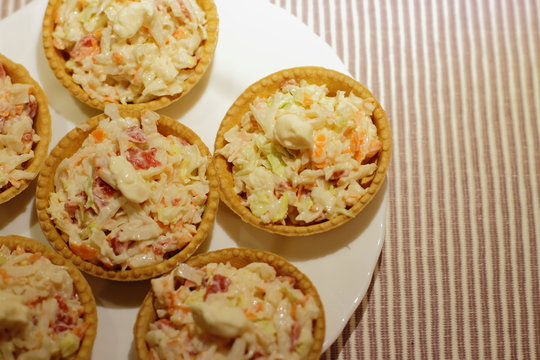 home made pintxos with crab meat and eggs and mayones sause in tartlet, traditional spanish snack 