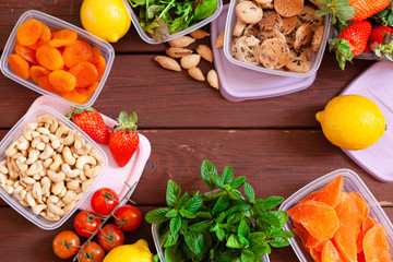 Top view of filled plastic containers to save food and fruits fresh, concept of economy household