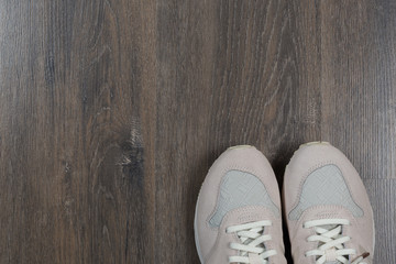 sport shoes on gray floor at home.