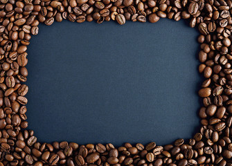squrare frame made of roasted coffee bean on sackcloth.