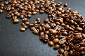 a lot of roasted coffee beans flying in the air