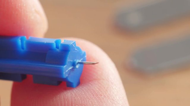 needle for pricking your finger to measure blood glucose level, macro, closeup