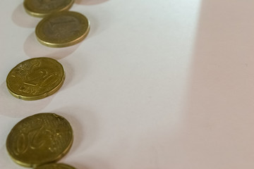 Golden euro coins shot close up on white background