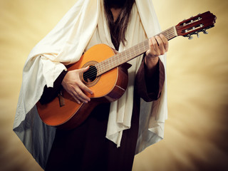 Jesus Christ plays guitar.