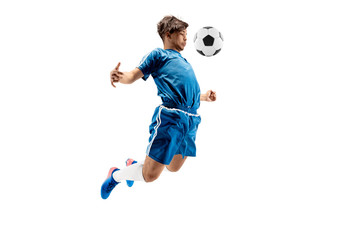 Fototapeta premium Young boy with soccer ball doing flying kick, isolated on white. football soccer players in motion on studio background. Fit jumping boy in action, jump, movement at game.