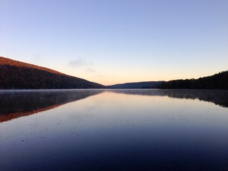 Obraz premium Dawn on Canadice Lake, one of the New York Finger Lakes; horizontal with copy space for text