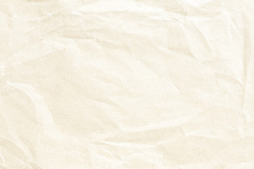 Old crumpled pale yellow paper texture