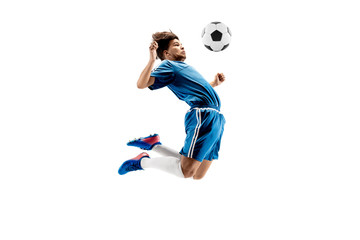 Fototapeta premium Young boy with soccer ball doing flying kick, isolated on white. football soccer players in motion on studio background. Fit jumping boy in action, jump, movement at game.
