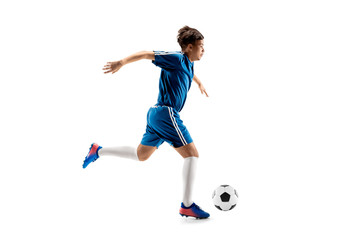 Young boy with soccer ball doing flying kick, isolated on white. football soccer players in motion on studio background. Fit jumping boy in action, jump, movement at game.