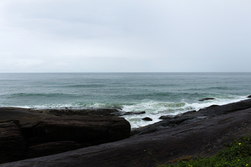 Sea forming waves in cloudy day