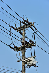 Rack with high-voltage wires. Blue sky