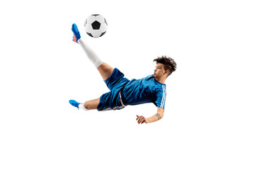 Young boy with soccer ball doing flying kick, isolated on white. football soccer players in motion on studio background. Fit jumping boy in action, jump, movement at game.