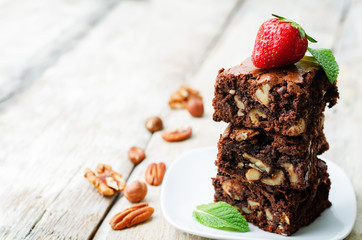 chocolate nut brownie cake decorated with strawberries