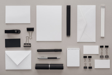 flat lay with black and white stationery on grey background