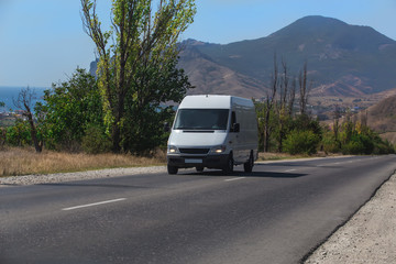 Fototapeta na wymiar Minibus Rides on the mountain highway