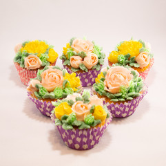 Baked homemade cupcakes with buttercream flowers