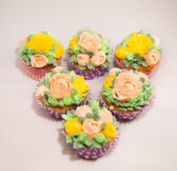 Baked homemade cupcakes with buttercream flowers