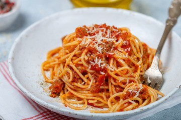 Pasta with tomato sauce, meat, cheese and spices. Lunch or dinner for gourmets. Spaghetti Bolognese. Italian (Mediterranean) cuisine. Selective focus