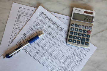 Tax Forms calculator pen paper finance business 