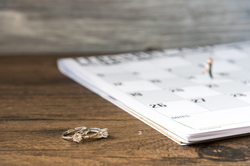 Male couple hugging kiss in a wedding ring 2 days on the calendar February 14, the day of love, Valentine day, marriage request, selected focus.