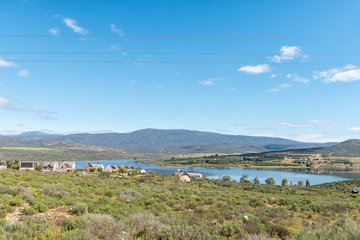 Fototapeta na wymiar Landscape with houses overlooking the Clanwilliam Dam