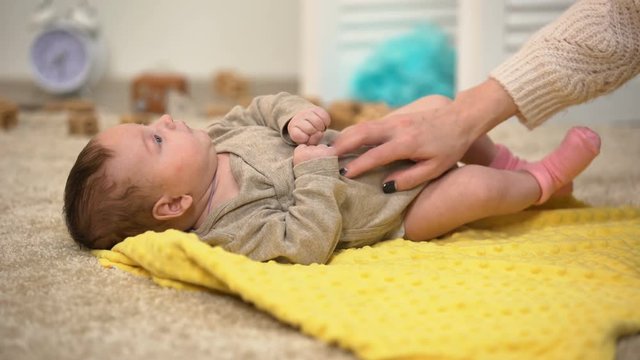 Mom Playing With Charming Baby Girl, Massaging Tummy And Tickling, Precious Time