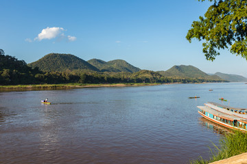 Fototapeta na wymiar fishing boats on the Mekong River, Luang Prabang