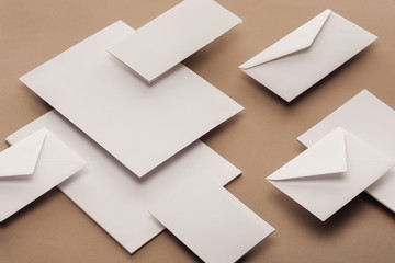 Flat lay with white envelopes, cards and sheets of paper